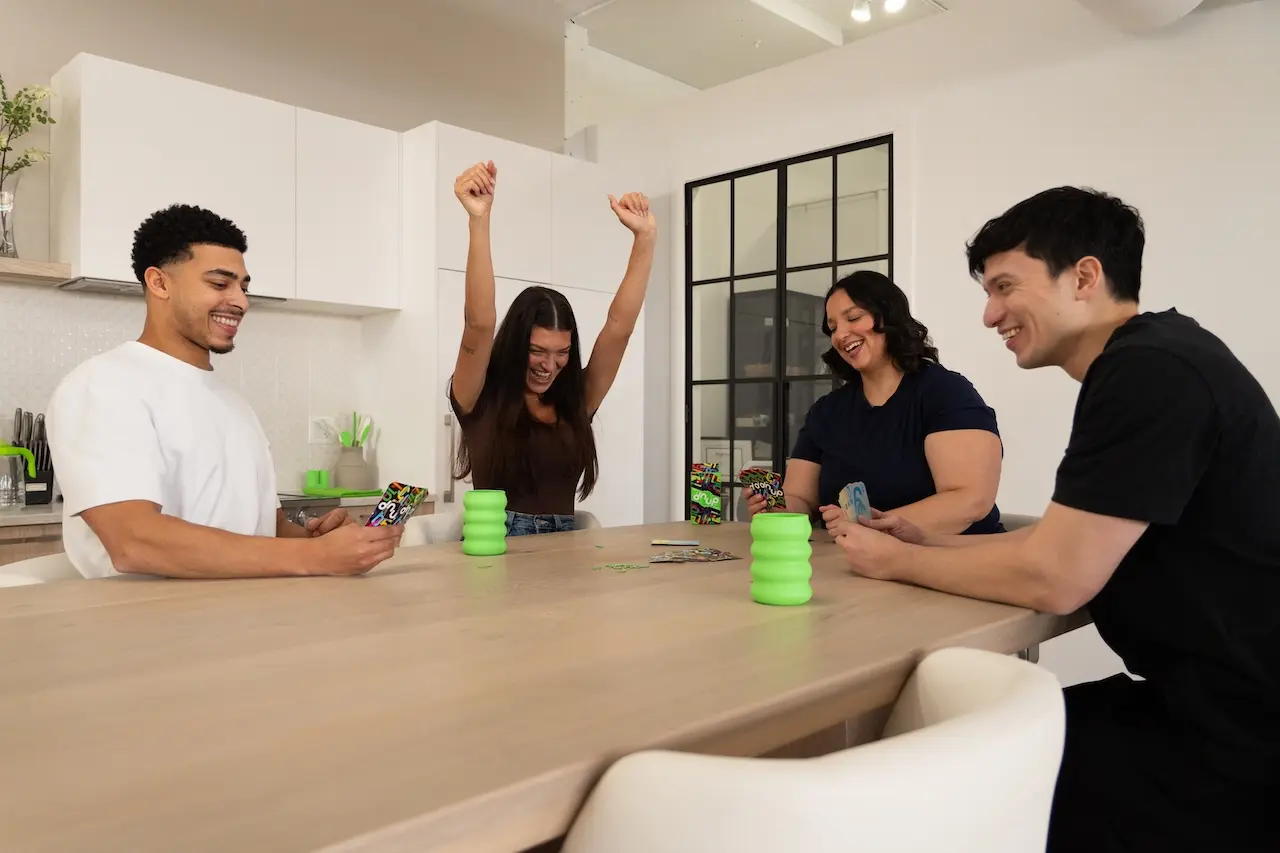 People having fun with dnup cards at a party